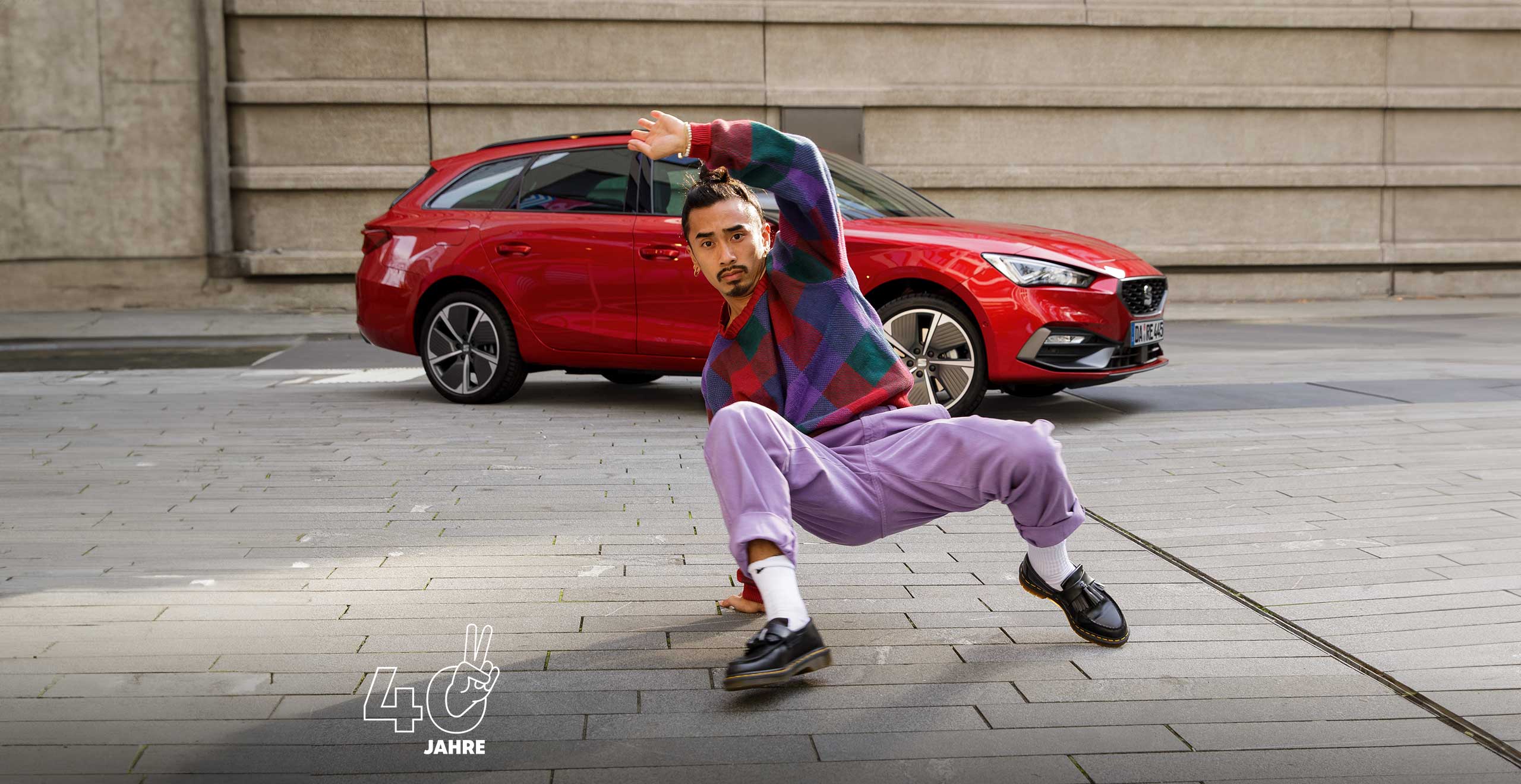 Man dancing in front of seat leon sportstourer