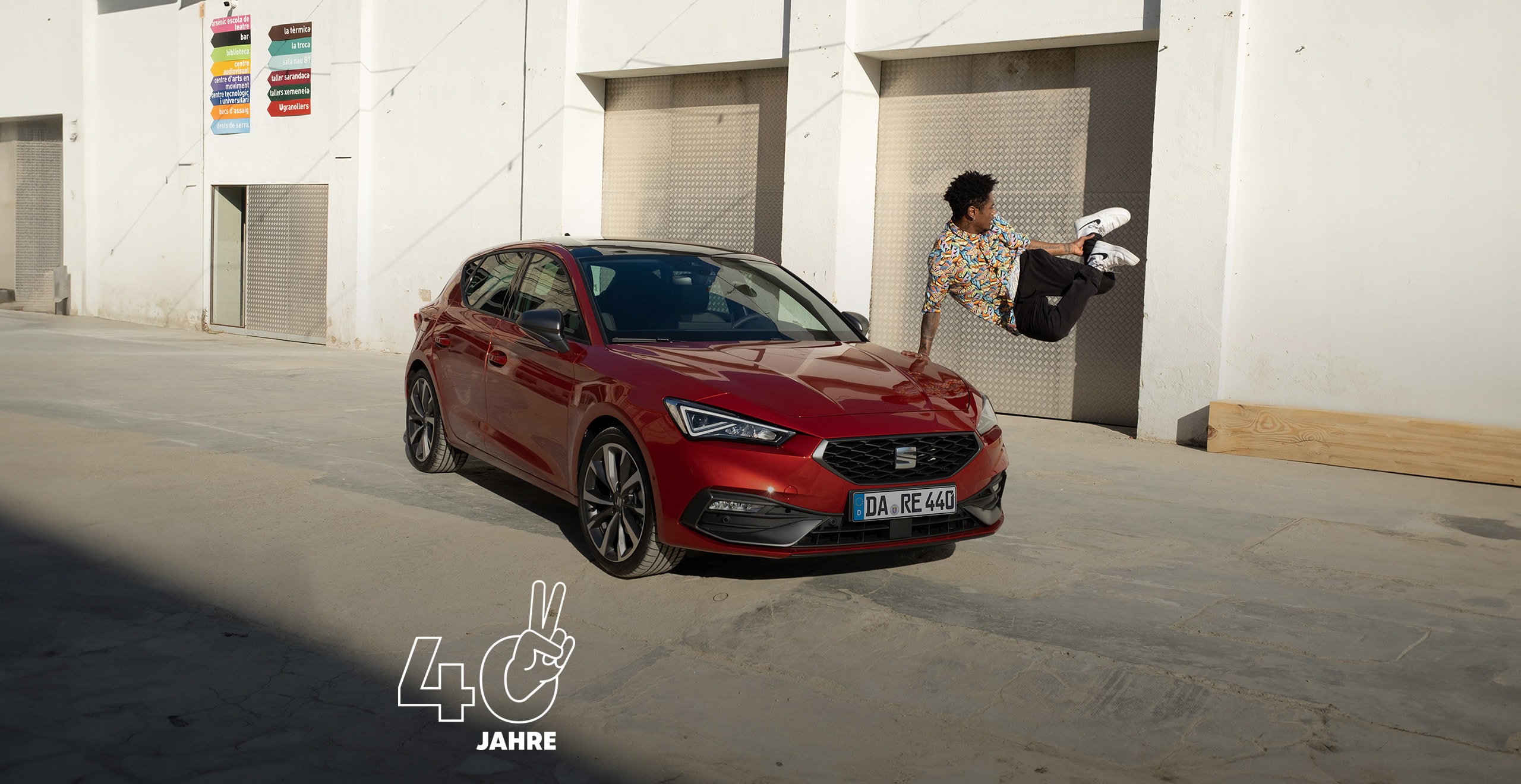 Man dancing next to seat leon