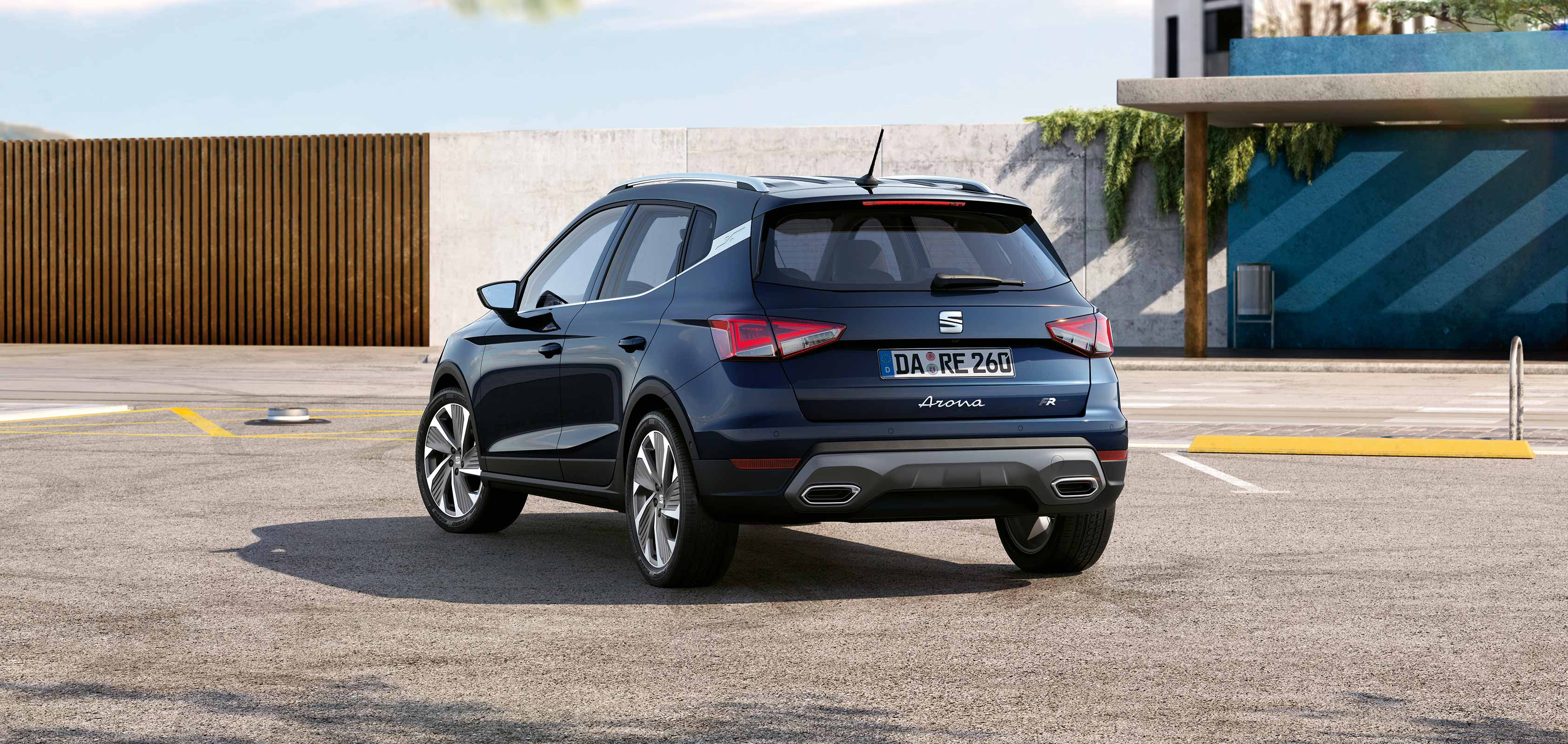 Rear view of SEAT Arona dark camouflage colour with a candy white roof   