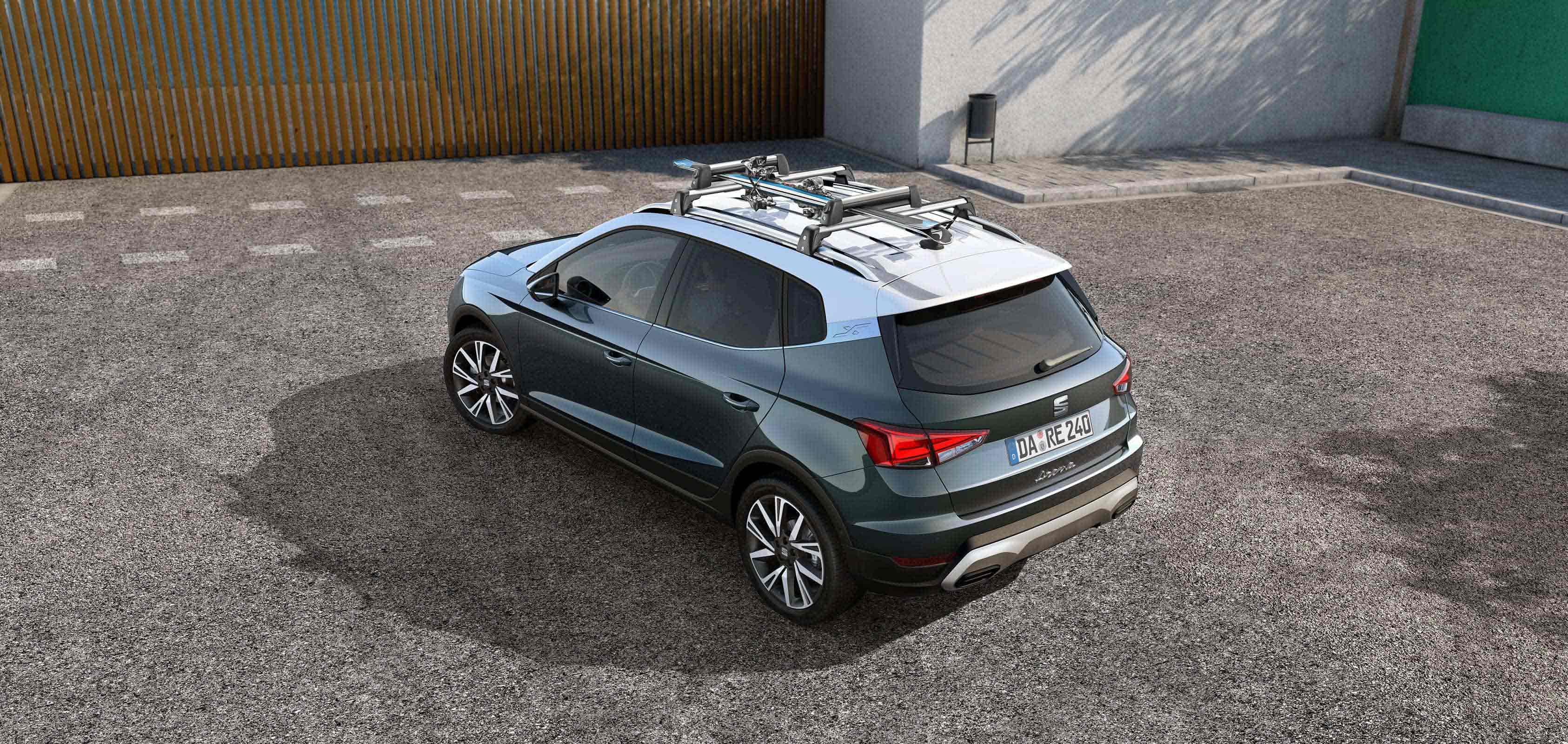 SEAT Arona dark camouflage with roof rack car