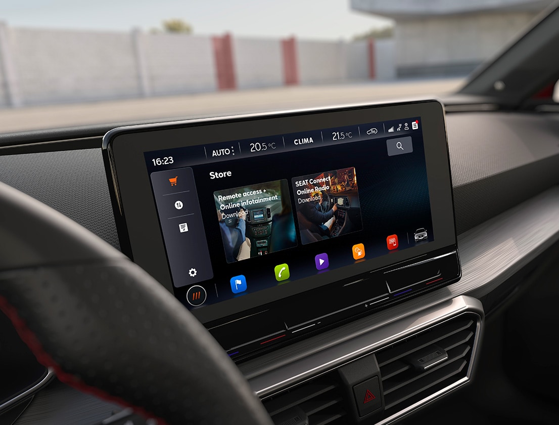 man walking away from the seat leon e-hybrid desire red colour using his smartphone