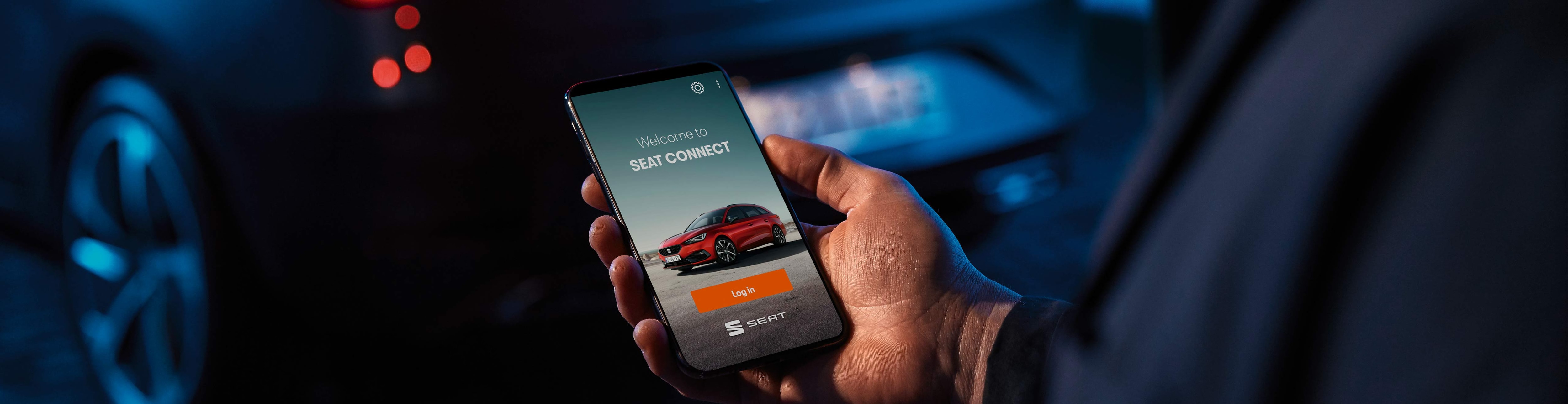 man-with-phone-seat-connect-app-welcome-screen